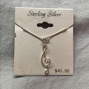 Treble clef necklace